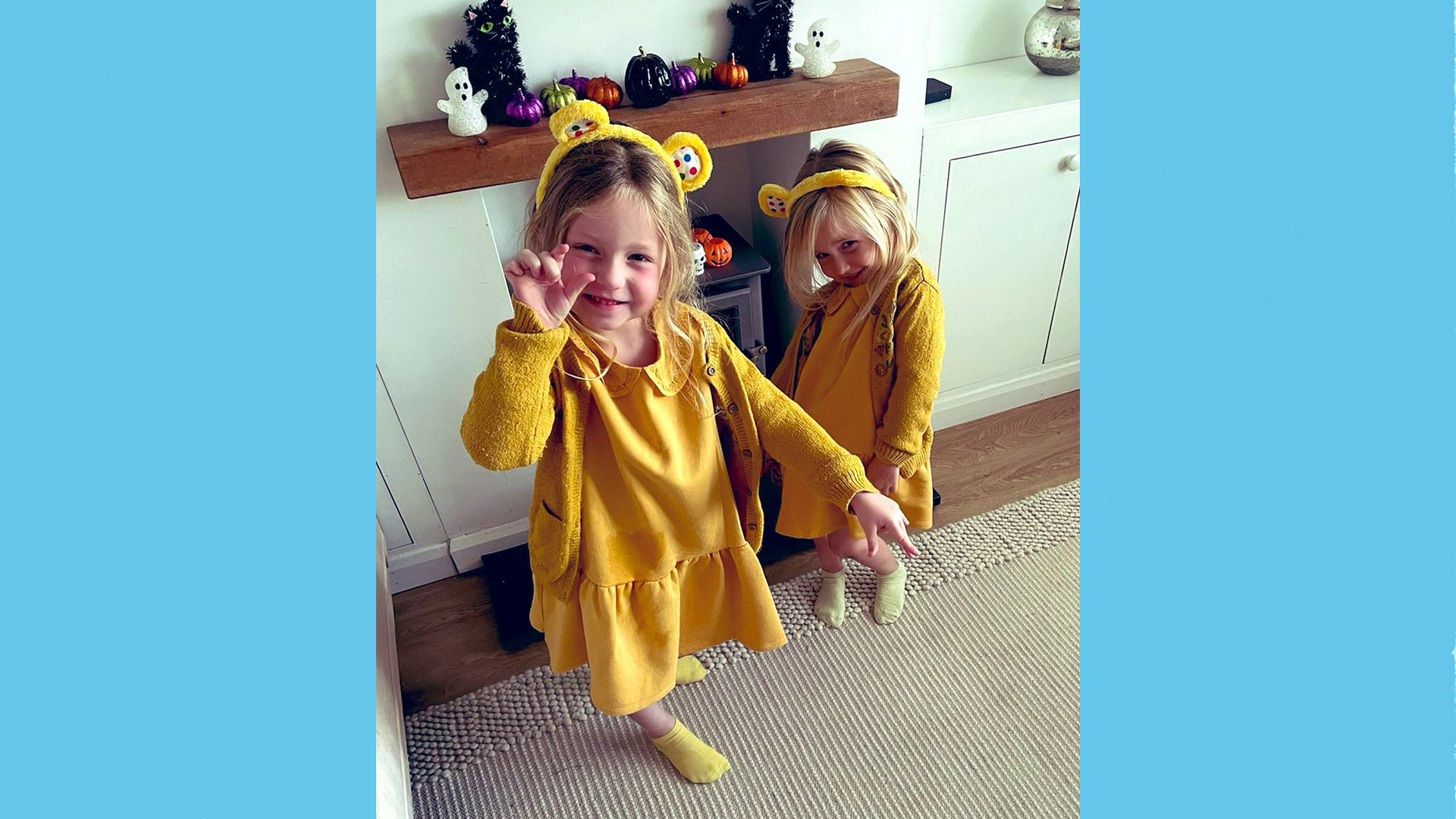 Two children from Brooklands Primary School dressed all in yellow with yellow bear ears.