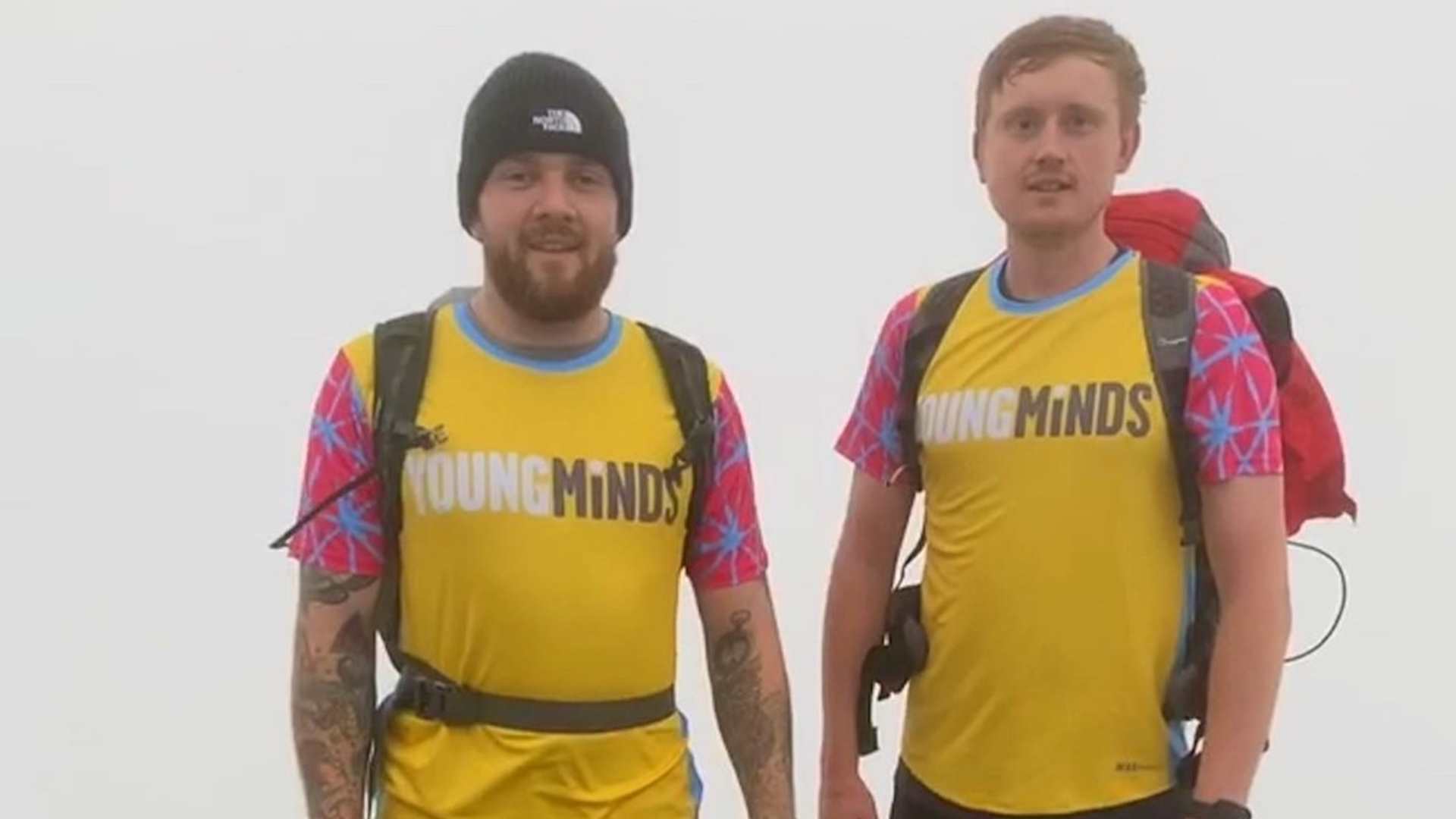 YoungMinds fundraiser Nathan Nash and another mountainer on a mountain peak