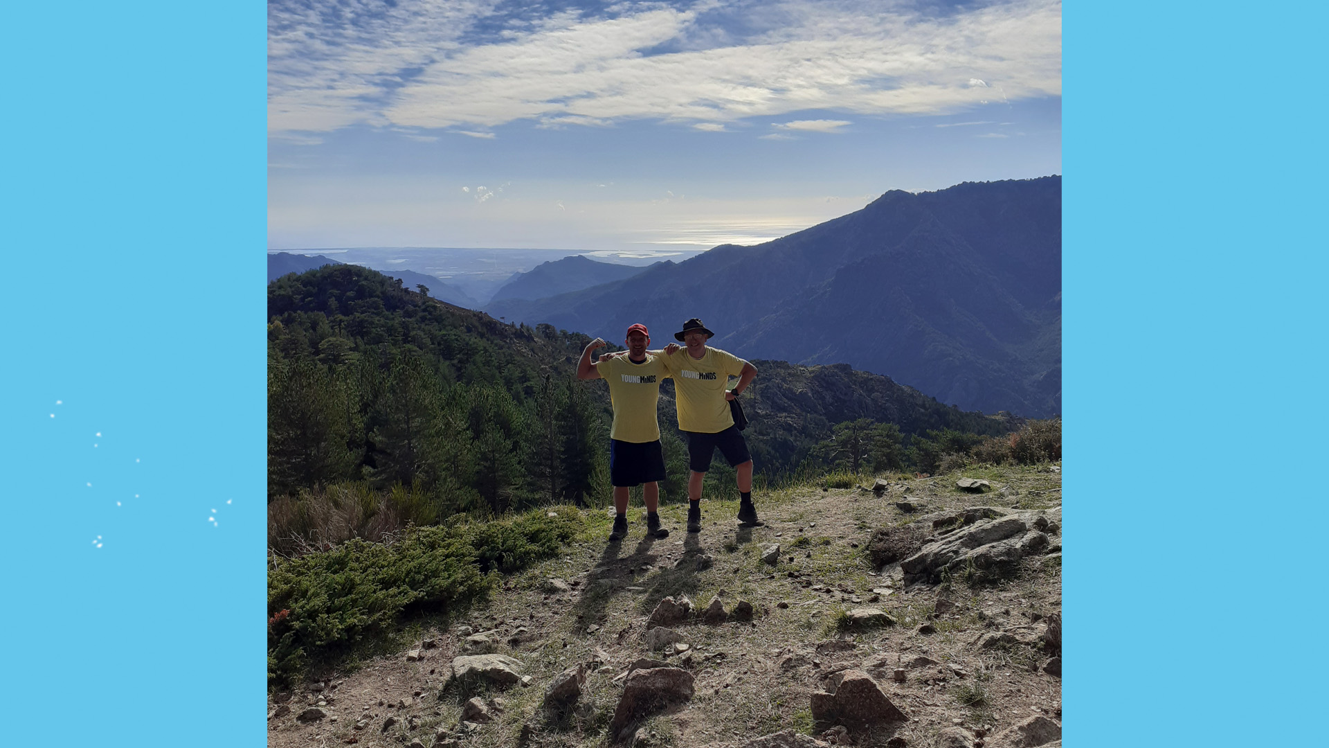 The Nicholls standing triumphantly on top of a hill.